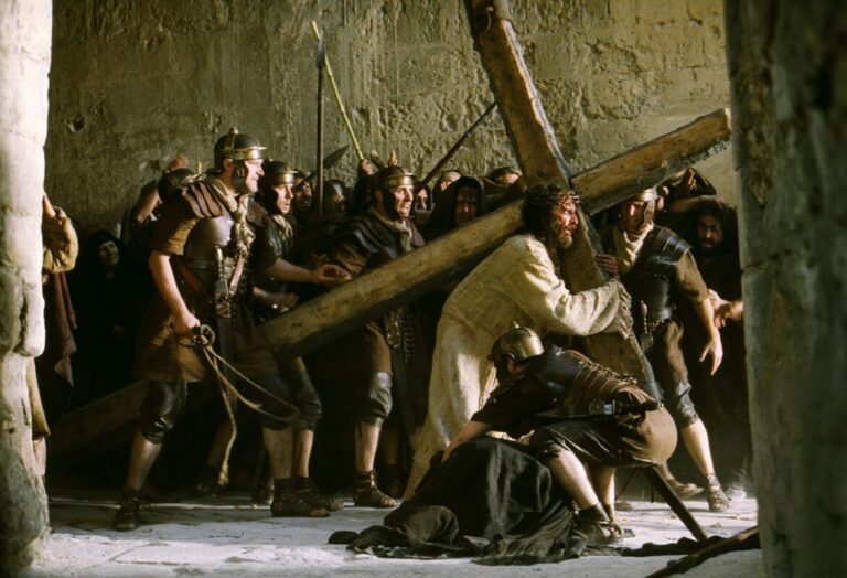 Jim Caviezel portrays Christ with his cross in a scene from the movie "The Passion of the Christ." Nearly 20 years after Mel Gibson's film hit theaters, Mel Gibson’s sequel, titled "The Resurrection of the Christ," will start shooting in August 2025 at Rome’s Cinecittà Studios, CEO Manuela Cacciamani has announced. (OSV News photo/Philippe Antonello, Icon Productions)